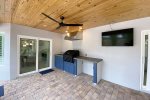 Summer Kitchen with BBQ grill & hood exhaust on patio,